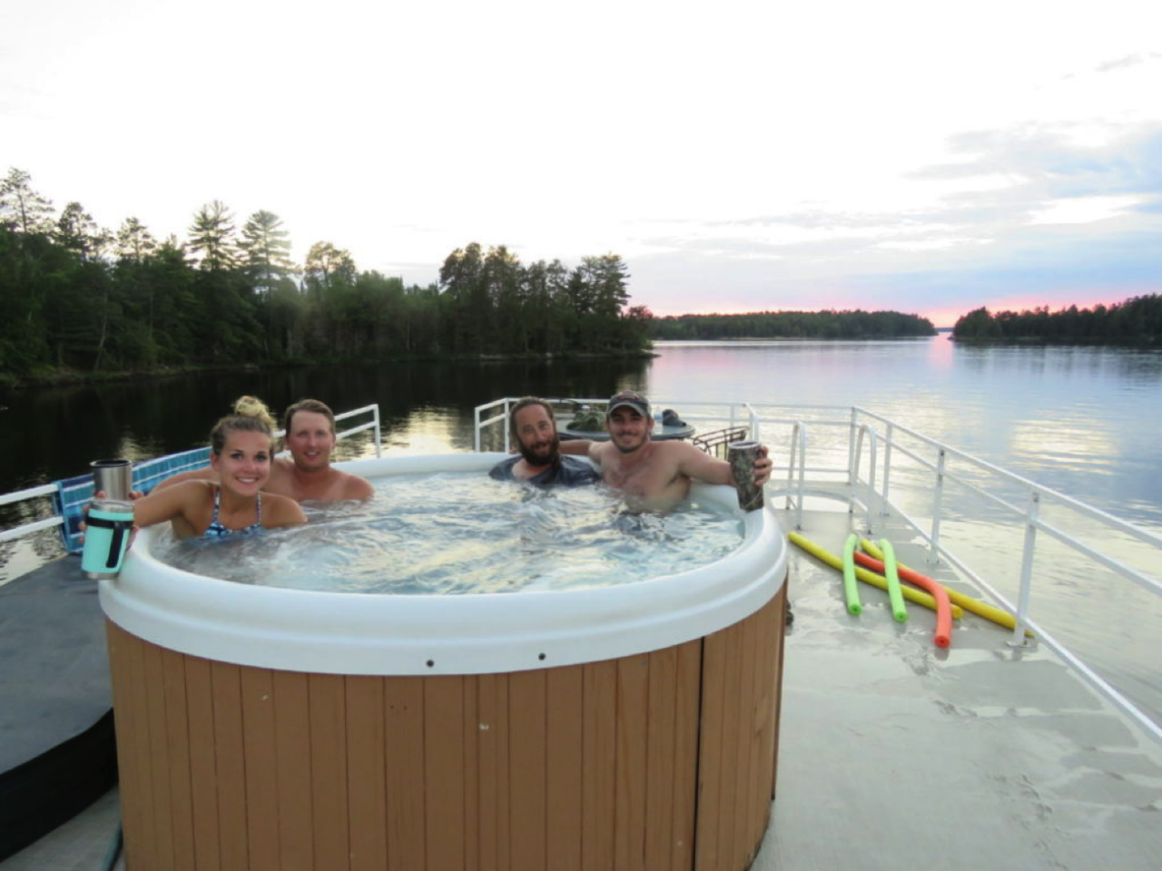 Friends enjoy hot tub at Rainy Lake
